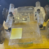 A model car made out of recycled clear plastic containers and water bottles.