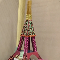 An Eiffel Tower model made out of recycled plastic materials.