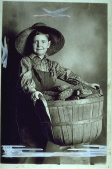 Young Boy Holding Basket