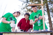 4-H youth conducting a science experiment under supervision
