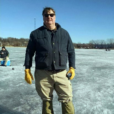 Brian Raney standing on a frozen lake.