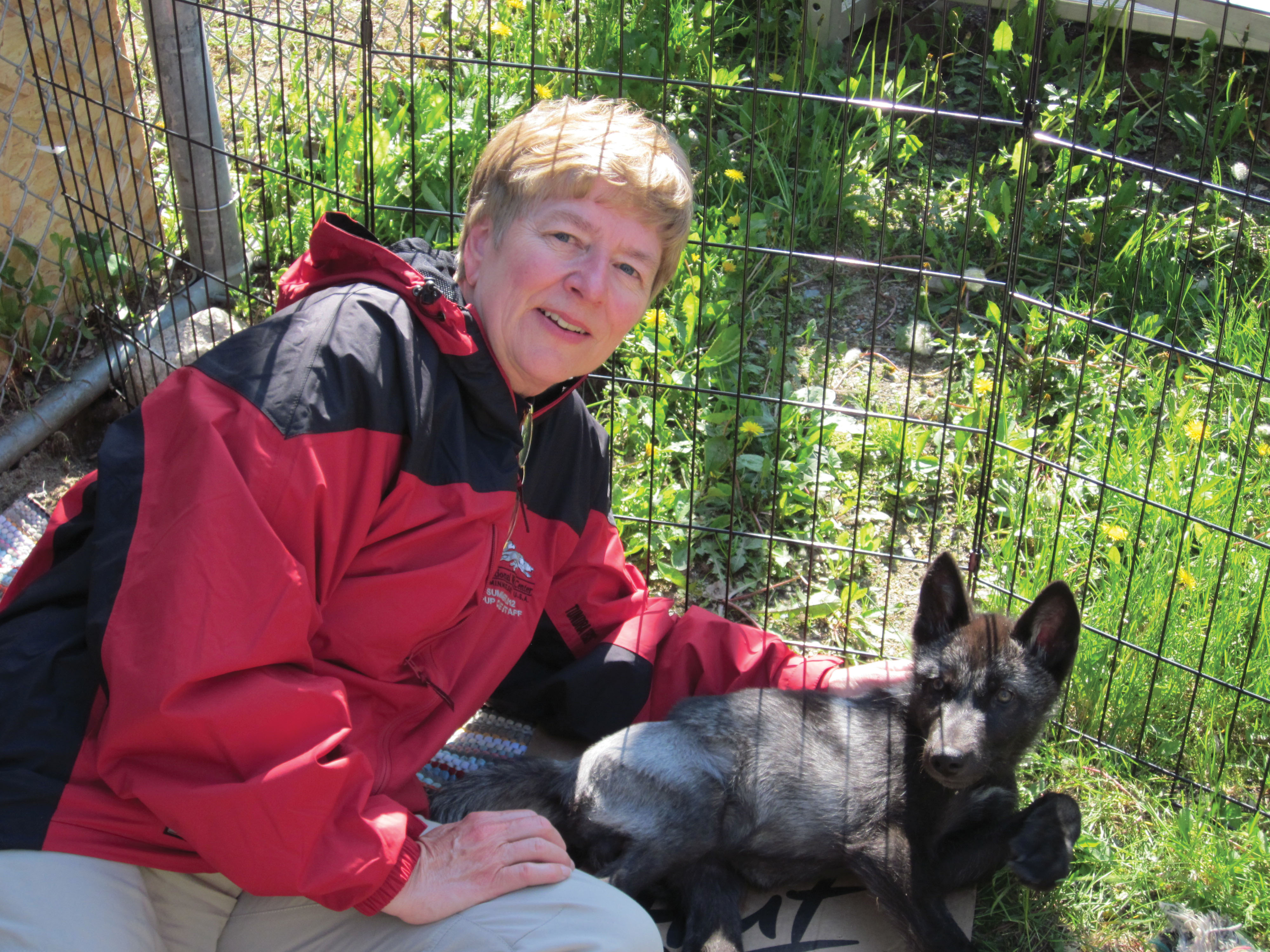 Debra Lewis with wolf pup