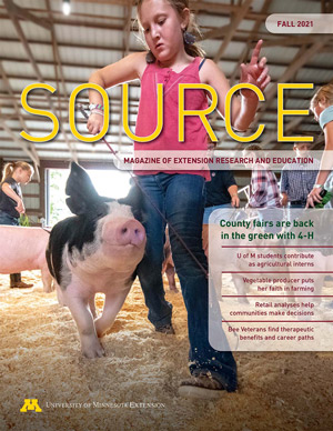 Cover of Source Fall 2021 with girl leading a pig at a contest.
