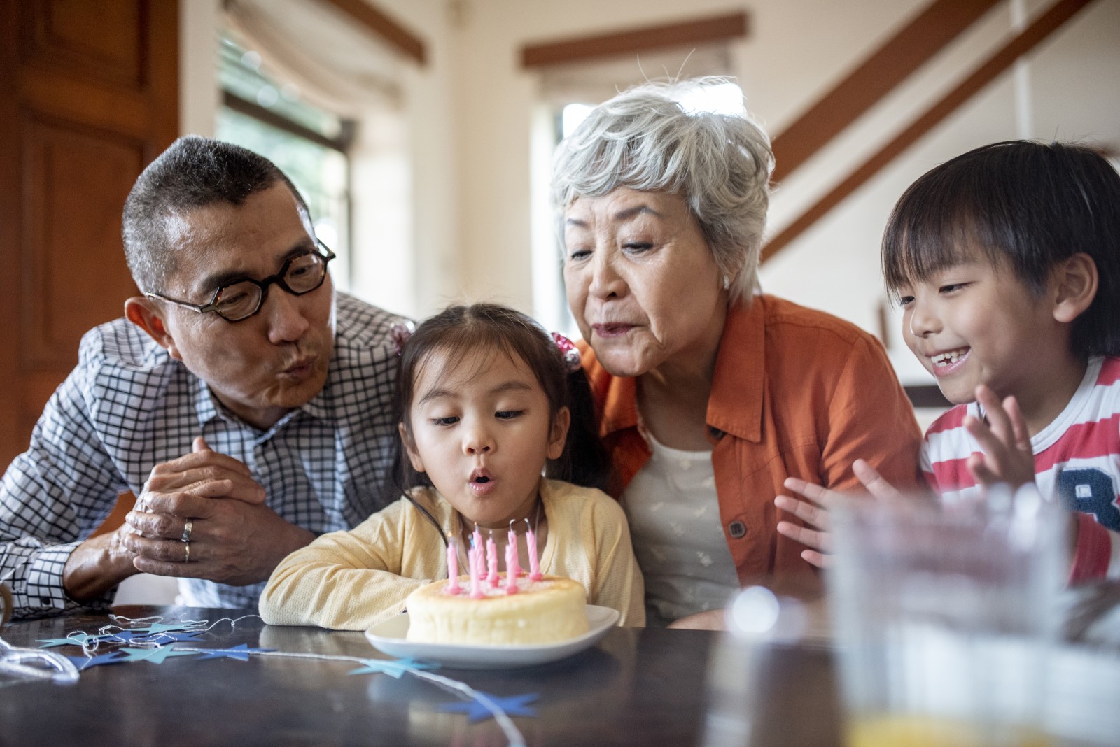 grandparents celebrate a birthday with young children