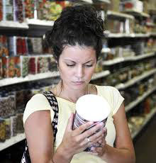 Woman reading a food label
