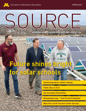 Cover of Source, spring 2022 magazine. Main story is "Future shines bright for solar schools" with photo of three men near a solar array.