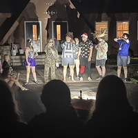 4-H camp counselors in a campfire skit