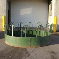 Tombstone style round bale feeders.
