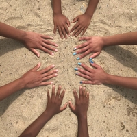 hands in the sand