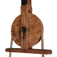 A wooden pulley with rope.
