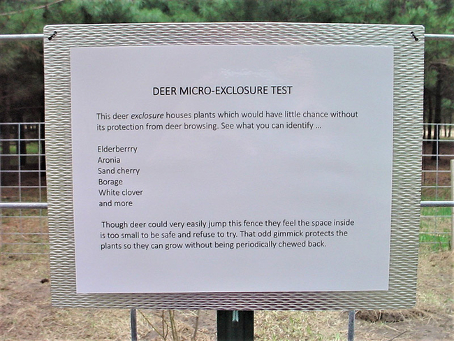 Picture of a sign from a deer exclosure explaining what is inside the fence and the purpose of the exclosure.
