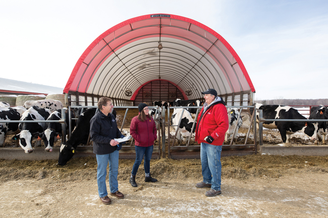 Educators and farmer on dairy farm