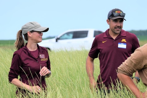Constance Carlson and Dr. Jake Jungers standing in a Kernza field.