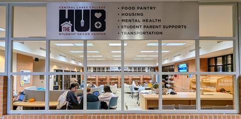 View of the student Hub food shelf and gathering space from outside a window.