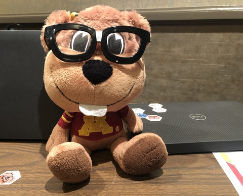 Stuffed animal of Goldy Gopher with black glasses, known as "IT Goldy"