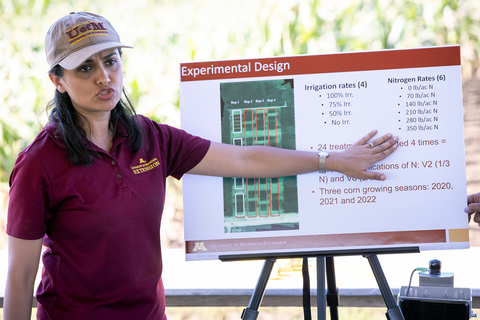 A woman presenting an irrigation chart.