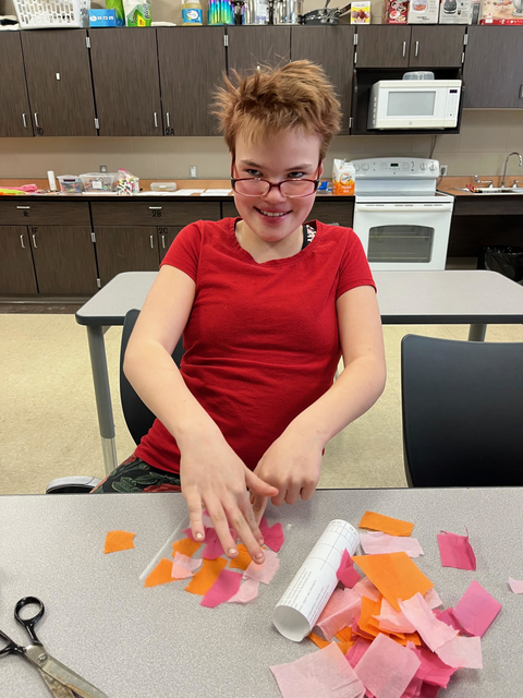 4-H youth work on a paper craft activity