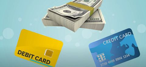 Animation of a credit card, debit card and two stacks of money