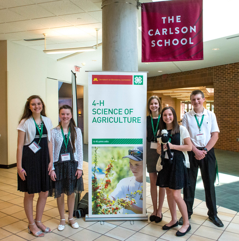 Five youth, representing the Mower County 4-H Lamb Jerky Team, at the Carlson School of Management.