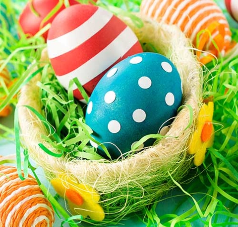 Colorfully decorated eggs in basket