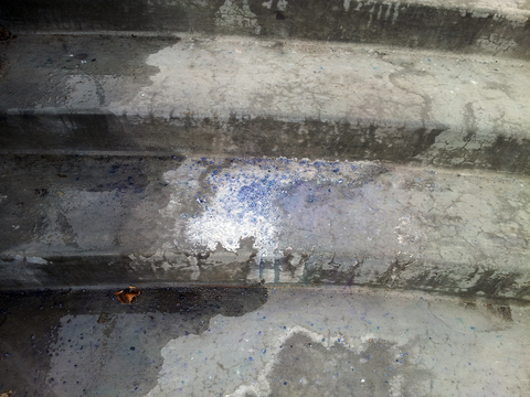 Cluster of deicing salt on cement steps.