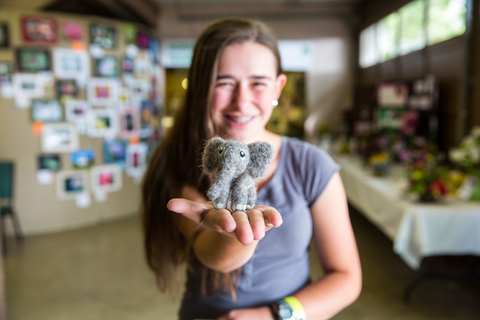 girl holding elephant craft project