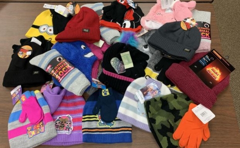 A pile of hats, mittens and socks.