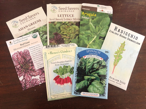 Seven packages of different seeds.