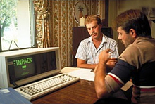 Two men using a computer