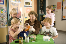 Woman cooking with children