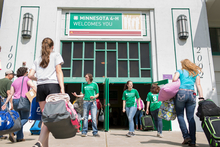 People walking into the 4-H building on the State Fair grounds