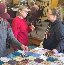 Bonnie discusses the project with quilters