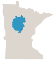 Map of Minnesota in gray with the central lakes woodland area colored in blue.