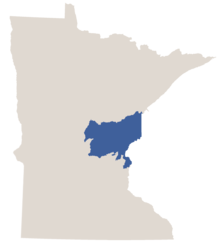 Map of Minnesota in gray with the east-central area known as the Mille Lacs Uplands and Glacial Lake Superior Plain colored in dark blue.