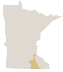 Map of Minnesota in gray with the southern woodland area known at the Oak Savanna colored yellow.