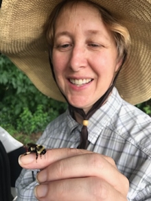 Elaine Evans with bee on her finger
