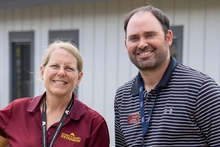 Julie and Jon smile for the camera outdoors