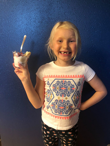Ivy Tiesler holding up a yogurt parfait