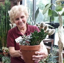 Karen Sutherland holding a potted plant