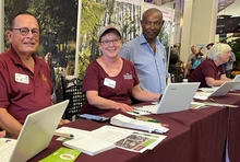 Master Gardeners at a table ready to answer questions