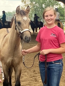 Brennan C. with her Quarter Horse