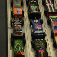 pinewood derby cars lined up for a race