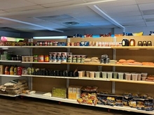 An interior shelf of Shashe Grocery featuring different non-perishable food items