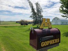 Minnesota Gophers mailbox with farm in background