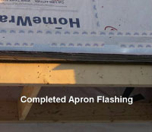 Completed apron flashing on house roof.