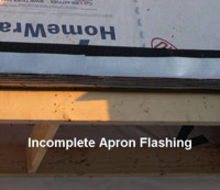 Incomplete apron flashing on house roof.