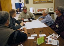 Farmers discussing climate adaptation at an RSDP event at the UMN Southwest Research and Outreach Center in Lamberton.