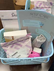 A plastic blue basket with self-care items