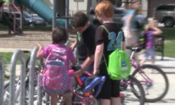 2 kids at bike rack
