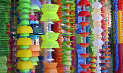 Hanging plastic sculpture in a variety of bright colors.